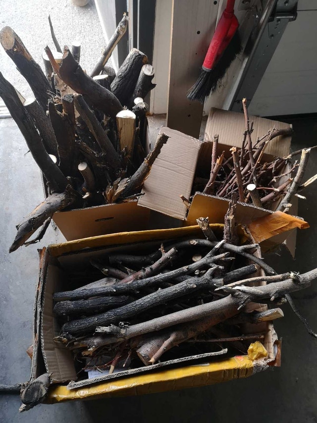 tree branches cut for fire place （boxes of fire wood)