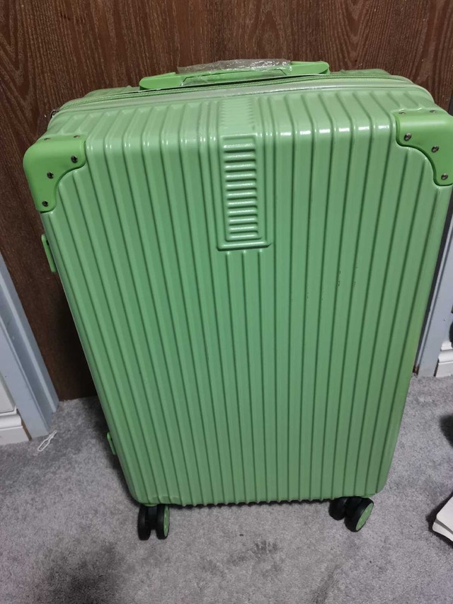like new green luggage 26"