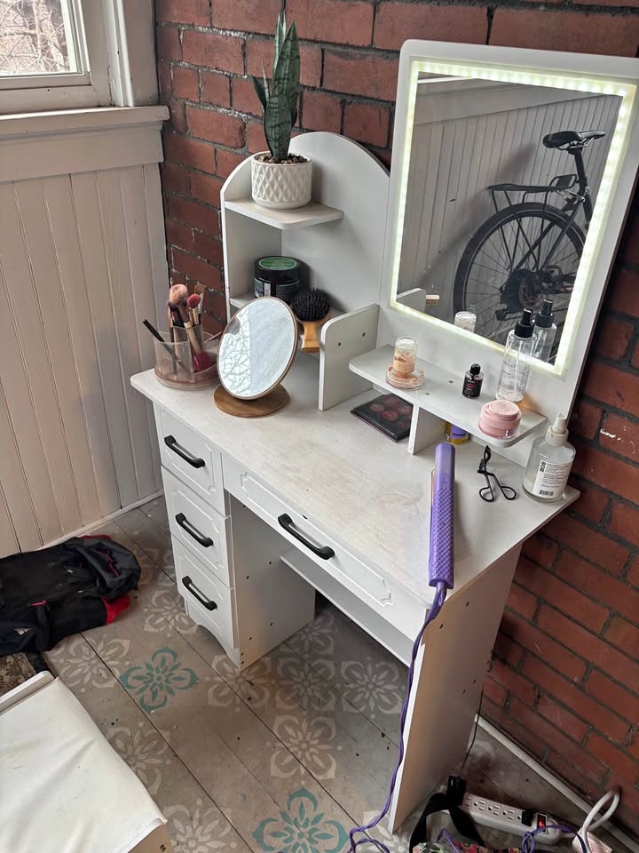 White vanity with LED lights and stool