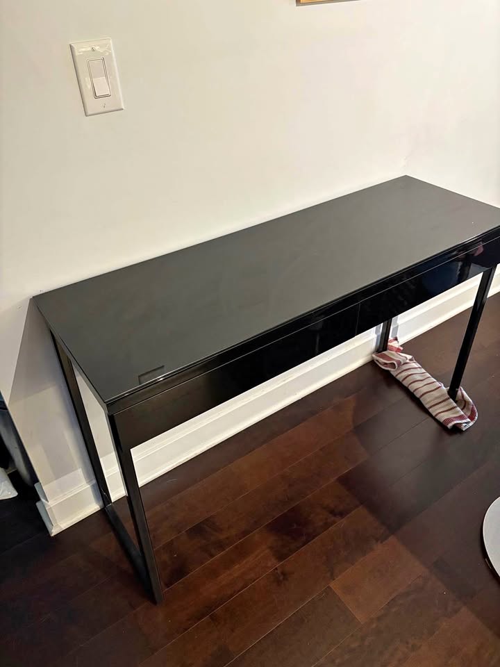 Black console table with drawers