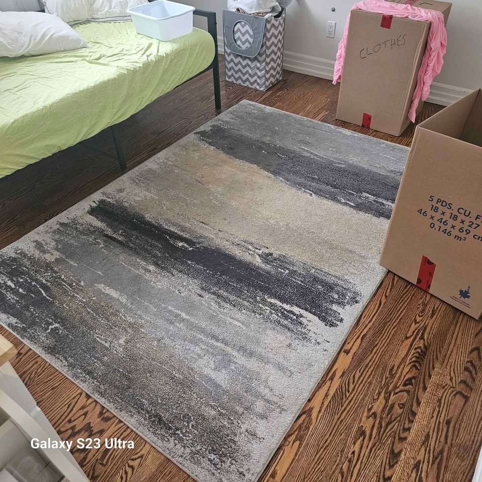 Black, white, gray, yellow carpet. Very cute. 10 ft x 6ft