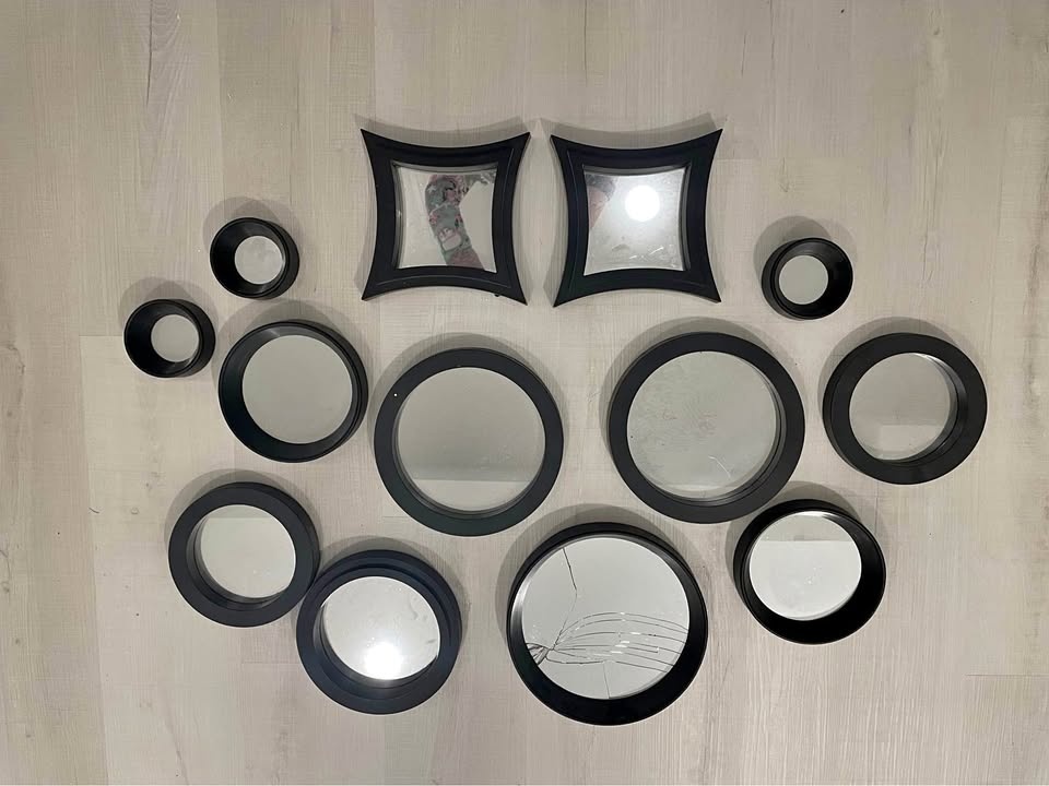 Collection of mirrors in black frames