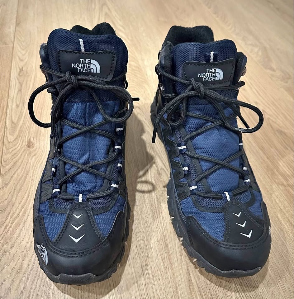 The North Face hiking boots in black and blue