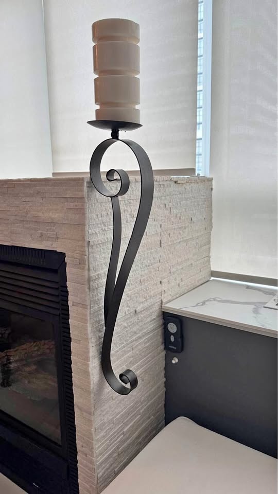 Wrought iron candle holder for wall
