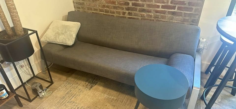 Grey couch sofa bed with metal legs