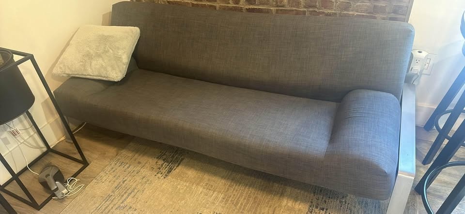 Grey couch sofa bed with metal legs - photo 2