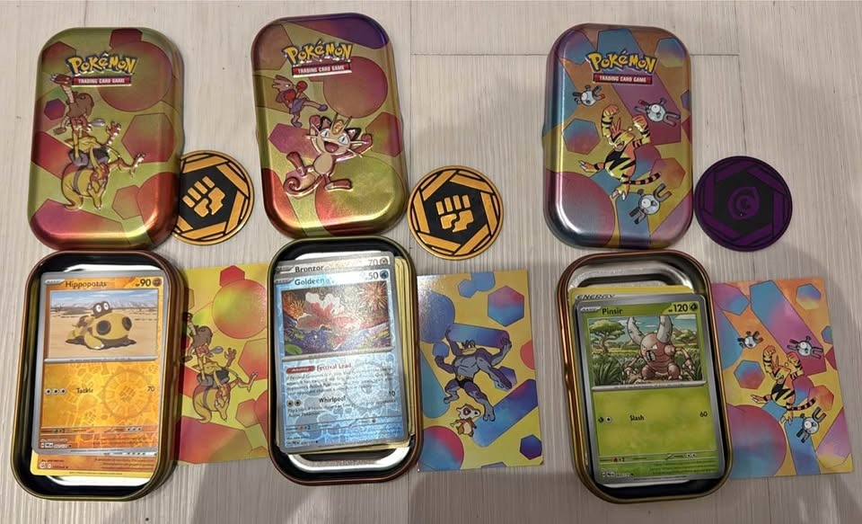 Pokémon card and tins and coin