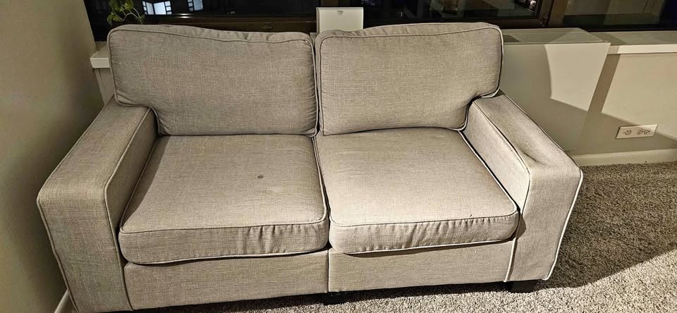 Two-seater sofa - (Dent on the Armrest as shown in the image)