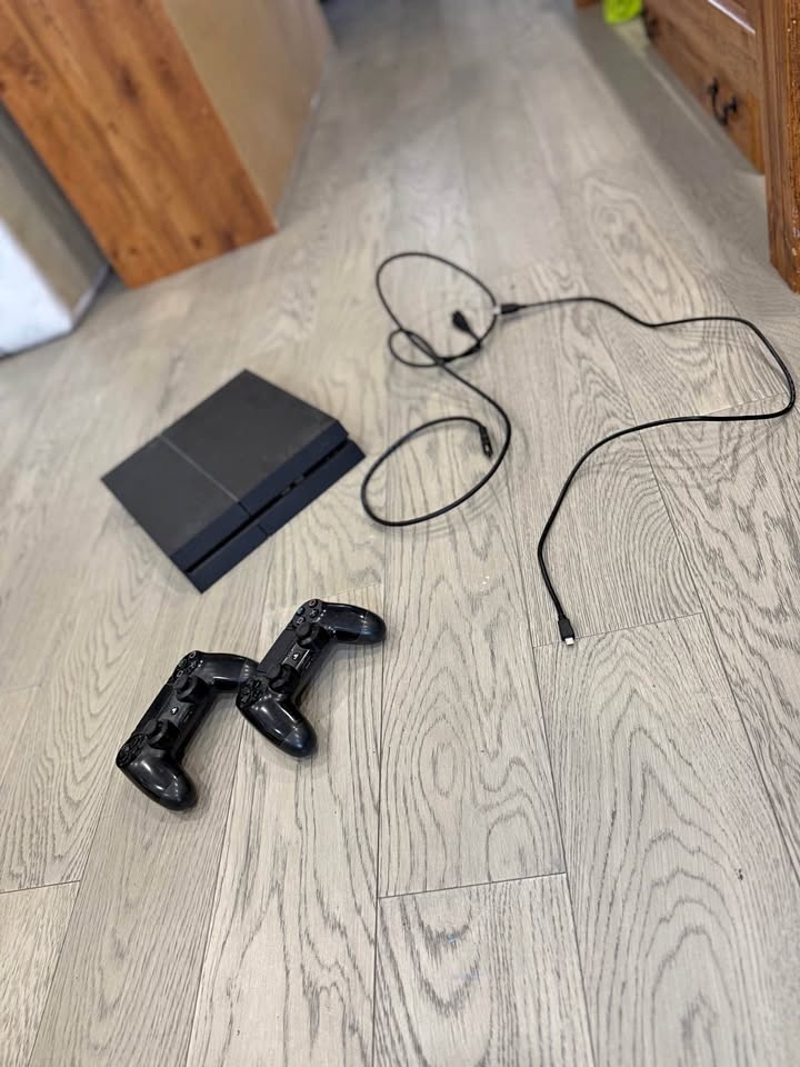 PS4 with two controllers and chords