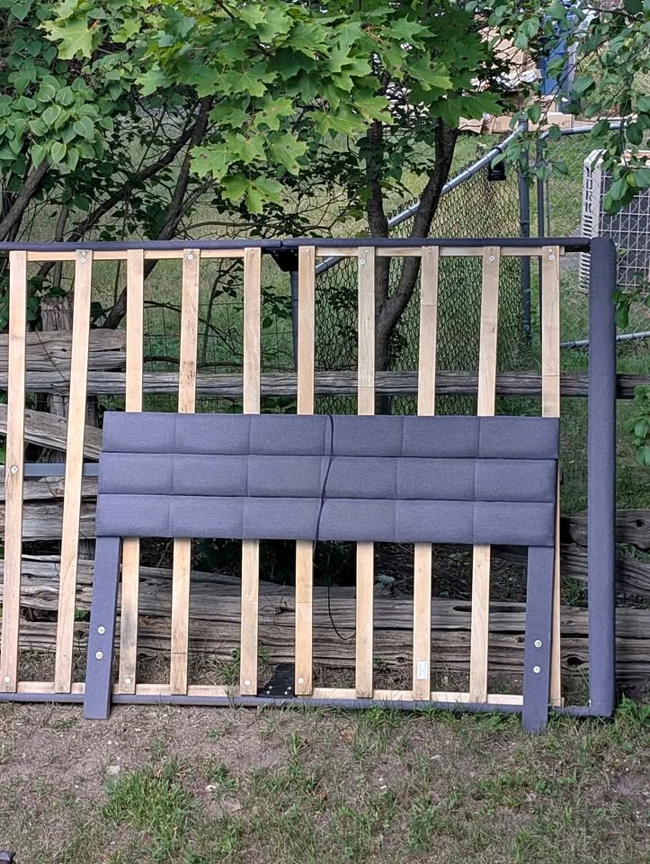 Queen sized bed frame with a headboard and USB charging