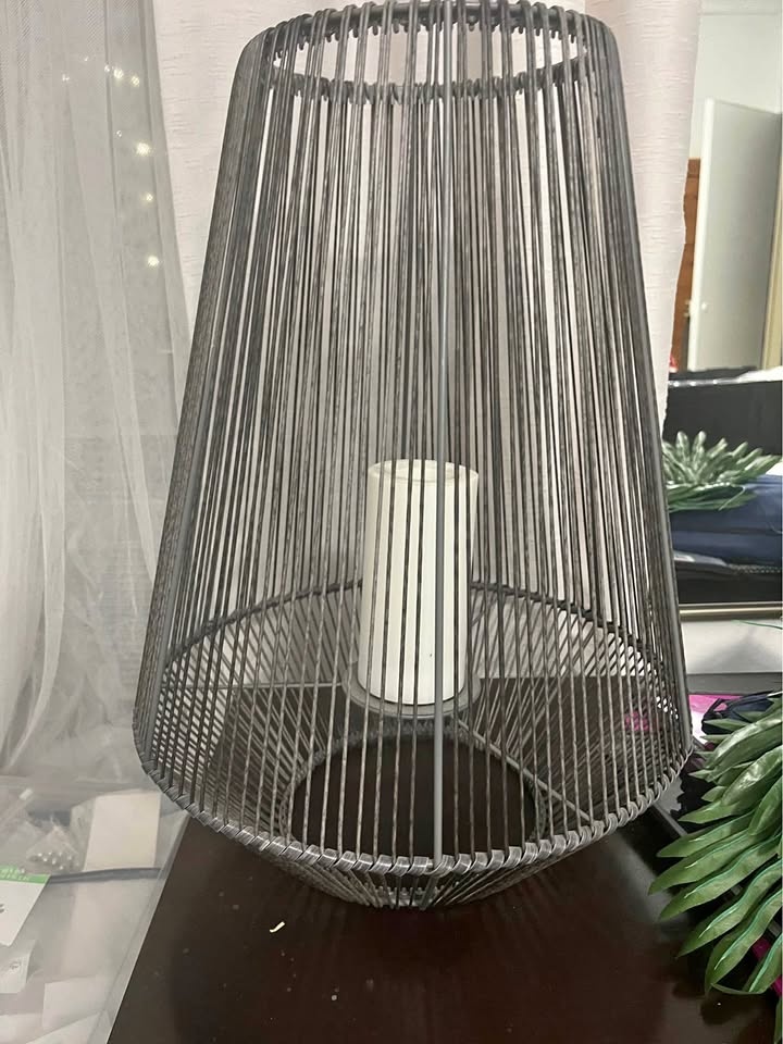 Grey accent light stand for a candle