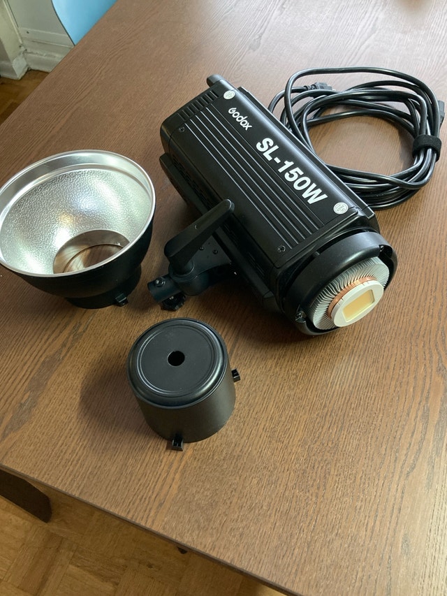 Godox SL-150W LED Video Light with a tripod light stand
