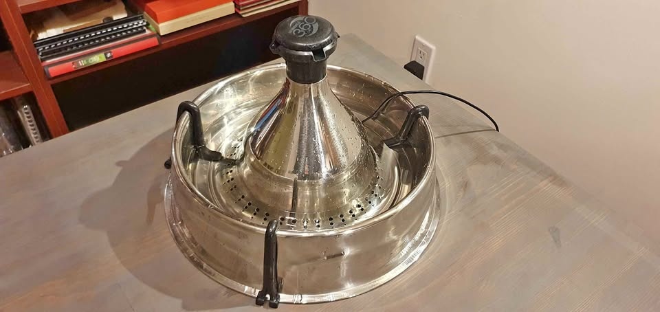 Stainless steel cat fountain.