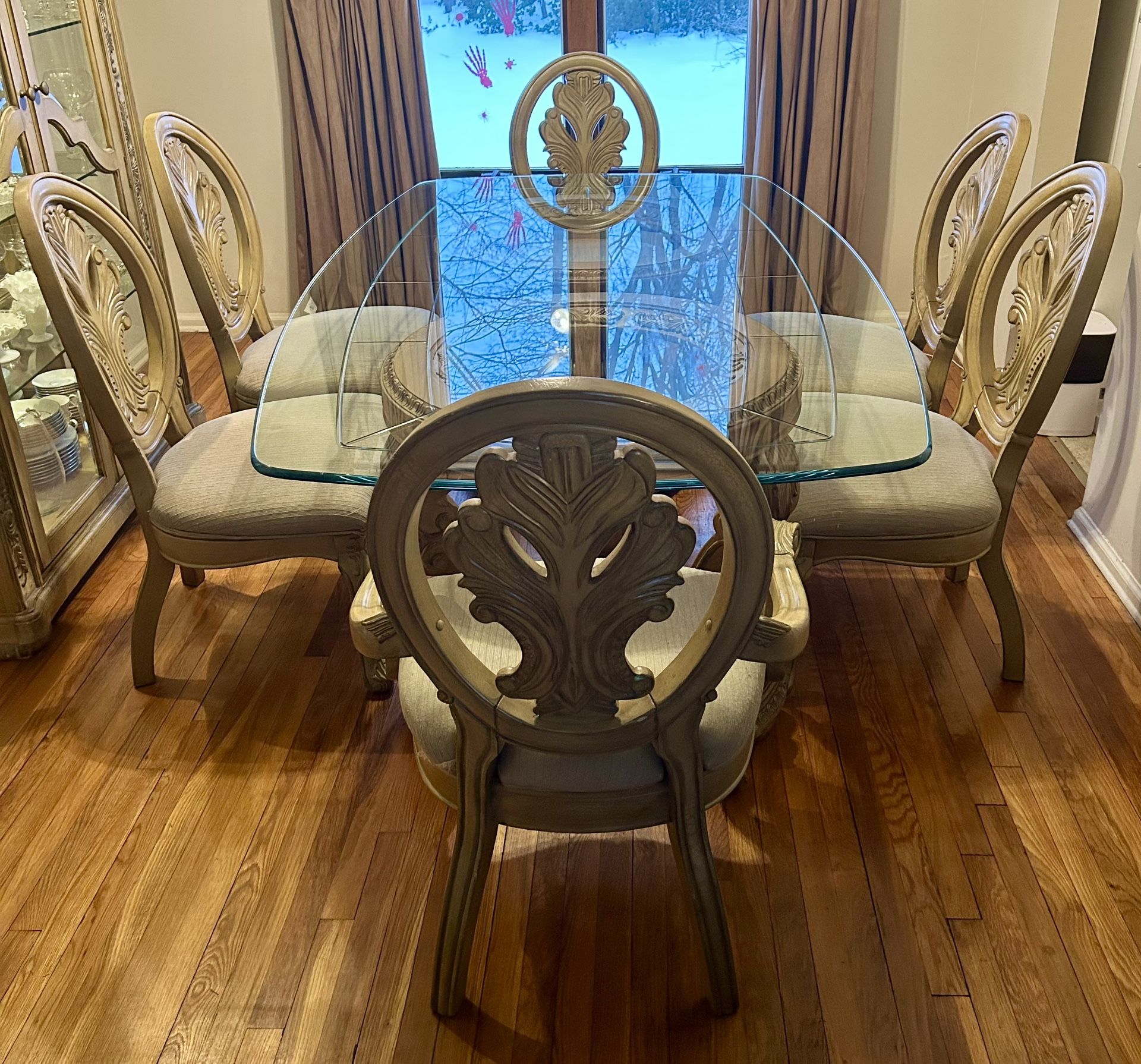 Gorgeous beveled glass top dining set with 2 ornate carved wood