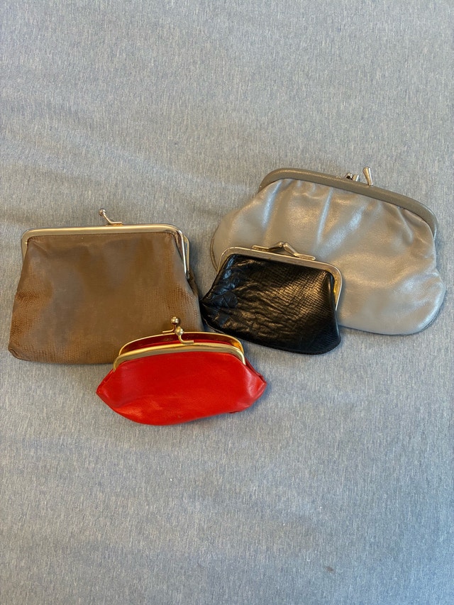 Collection of change purses and jewelry pouches.