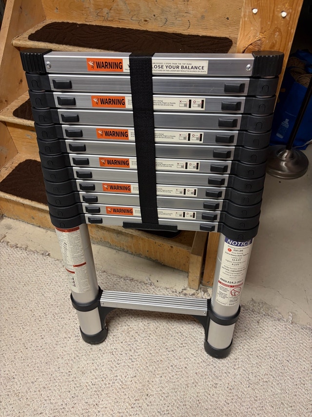 Brand new 12.5 ft telescoping ladder