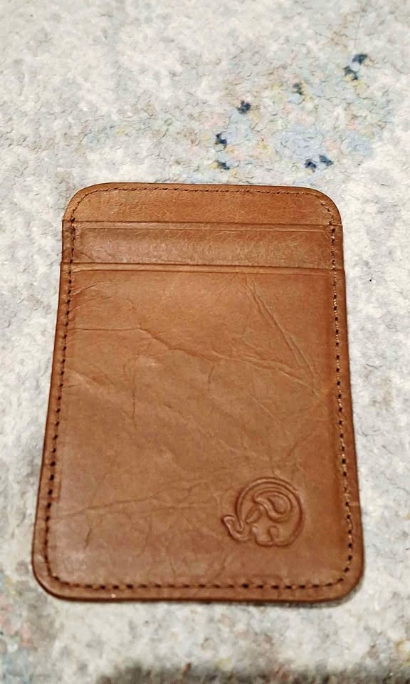 Brown leather card holder with elephant logo