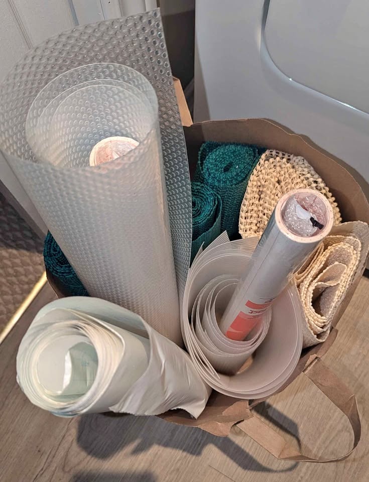 Bag of Shelf Liners, Plastic Wrap, Adhesive Covering