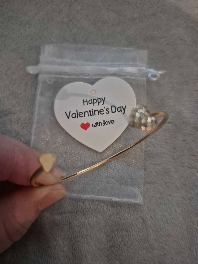 Gold Tone Bangle Bracelet with Heart Details