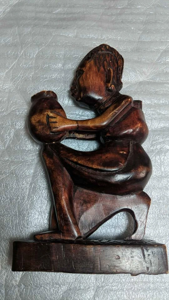 African wooden female sculpture