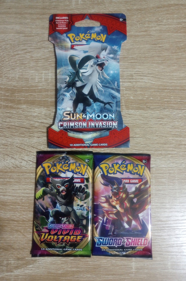 3 Pokemon Booster Packs & 2022 Sticker Calendar
