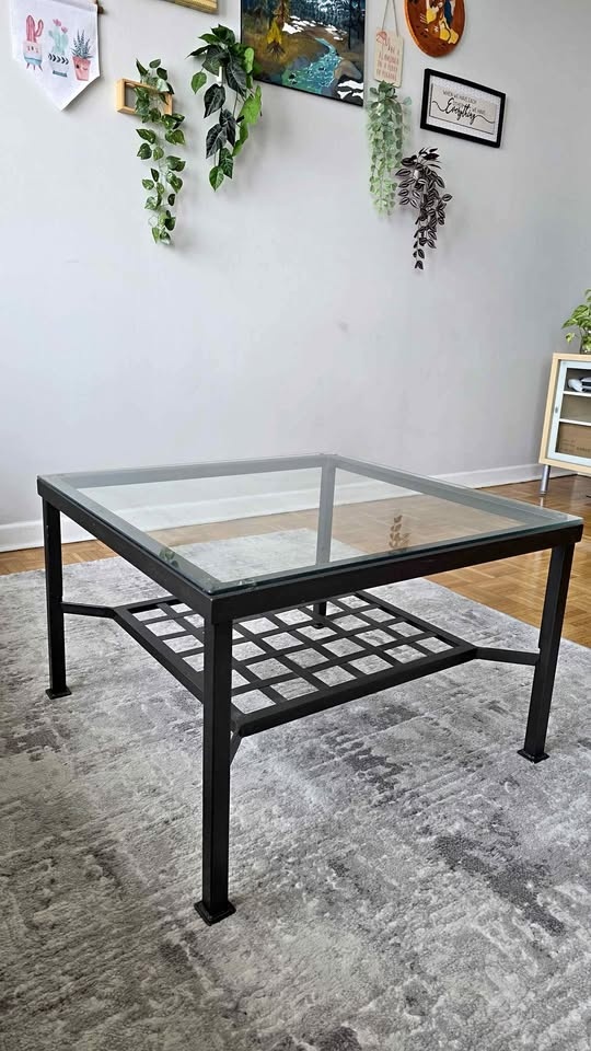 Glass top coffee table with metal frame