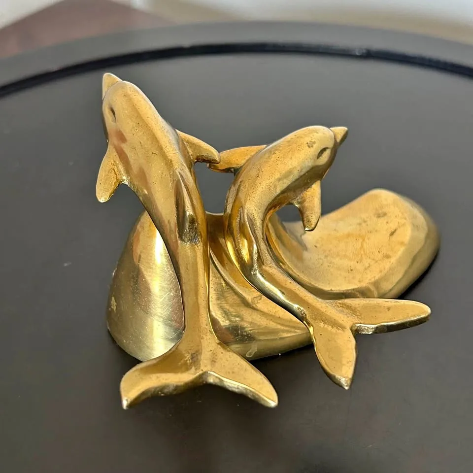 Small Brass Dolphins Riding an Ocean Wave Sculpture thumbnail