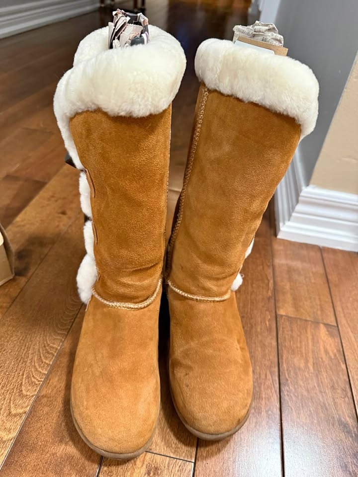 Brown fur lined boots with toggle buttons