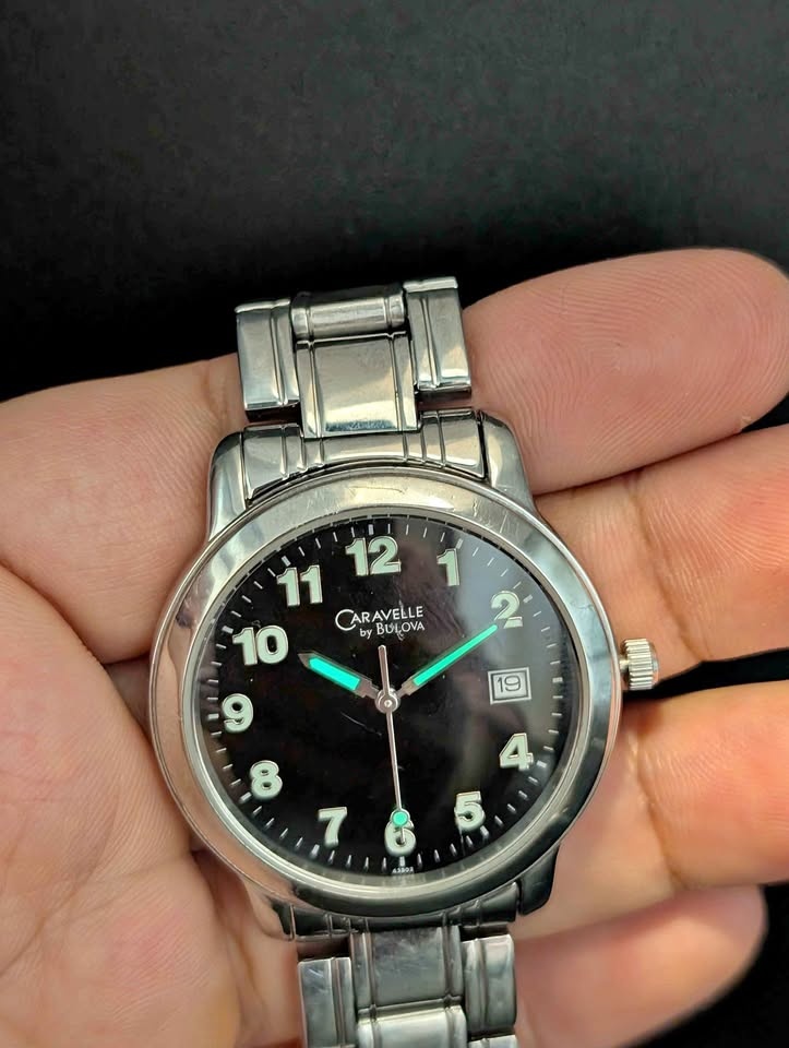 Caravelle by Bulova Silver Tone Watch Black Dial