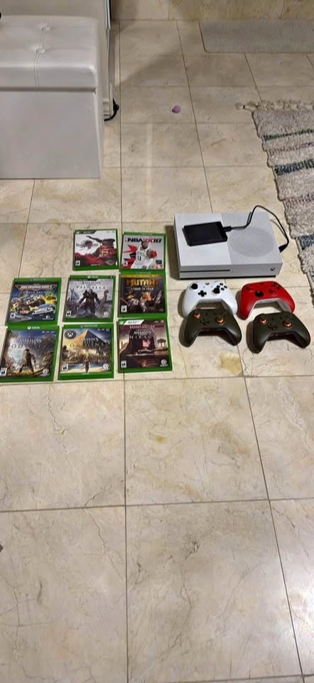 Xbox 1 with storage, 4 wireless controllers, 8 games