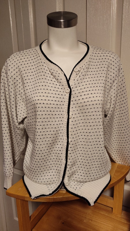 Ladies white with black accents cardigan sweater retro style.