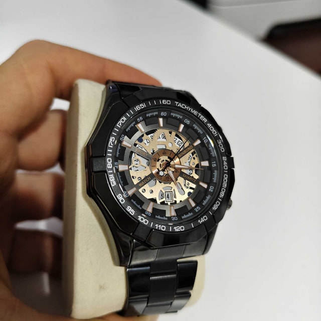 Stylish Full Metal Men’s Watch – Black & Gold Skeleton Design