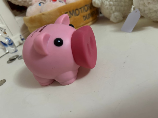 Mini piggy bank full of penny’s