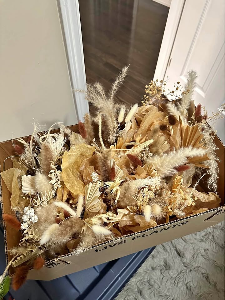 Brown bottles with dried flowers