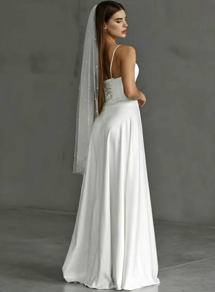 Soft white fingertip veil