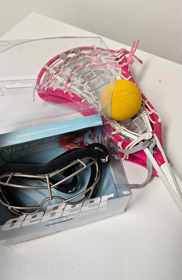 Girls pink lacrosse stick, goggle set + ball. Teen sized
