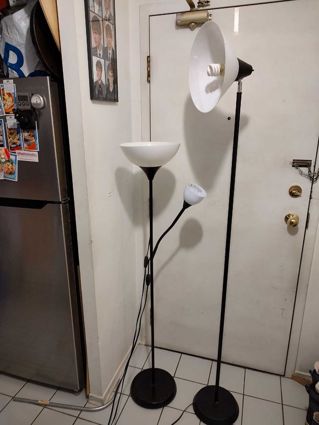 Two floor lights, five and six feet tall with adjustable heads