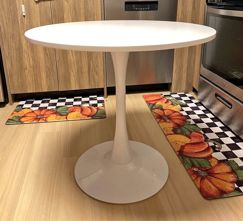 Round dinner table with metal base