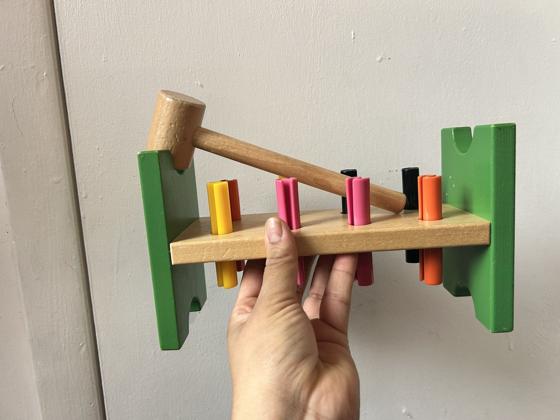 Pegboard with hammer