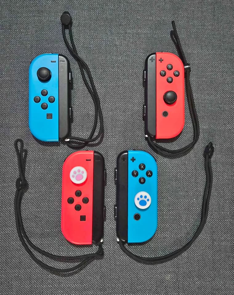 2 sets of Joy-Cons (L)/(R) Neon Red/Blue w straps. Like New!