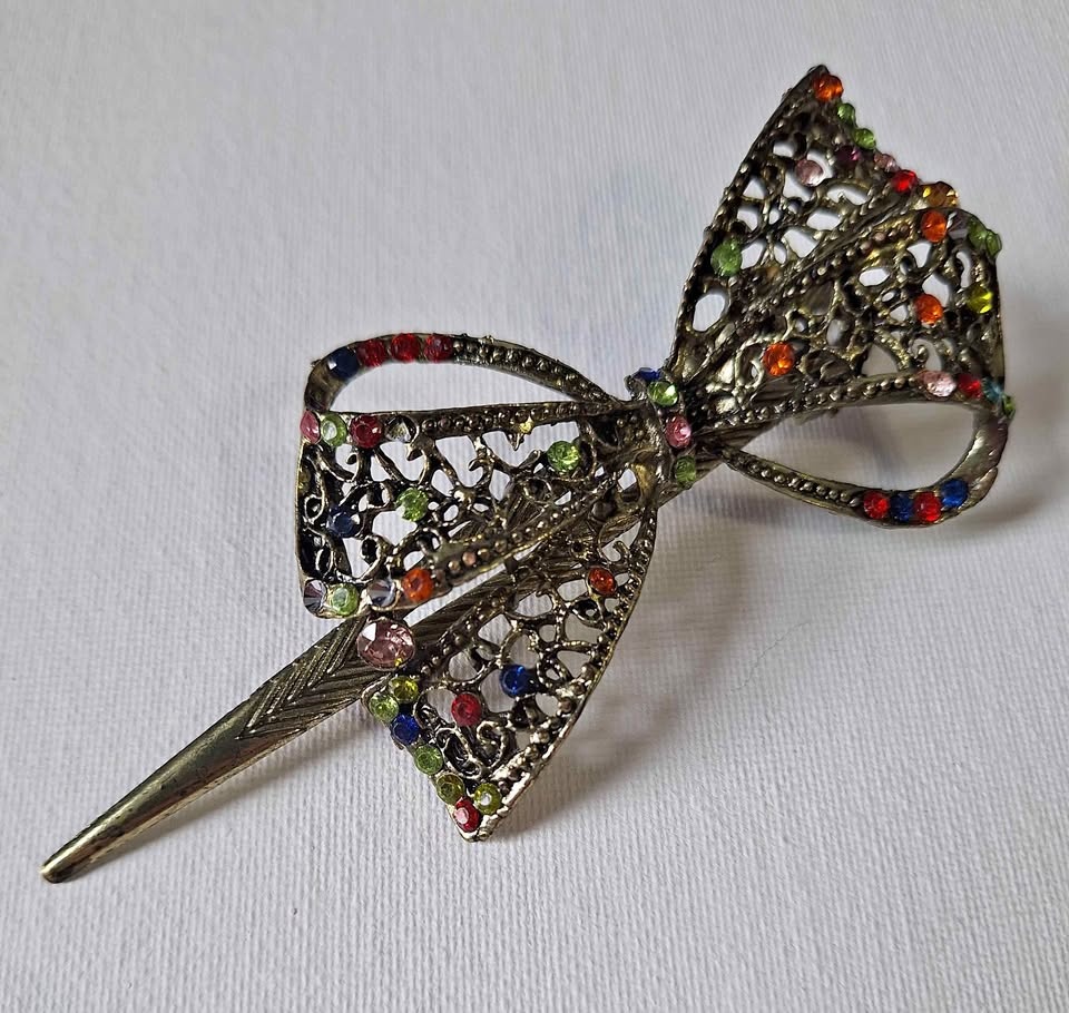 Vintage brass tone rhinestone bow hair clip almost 5" long