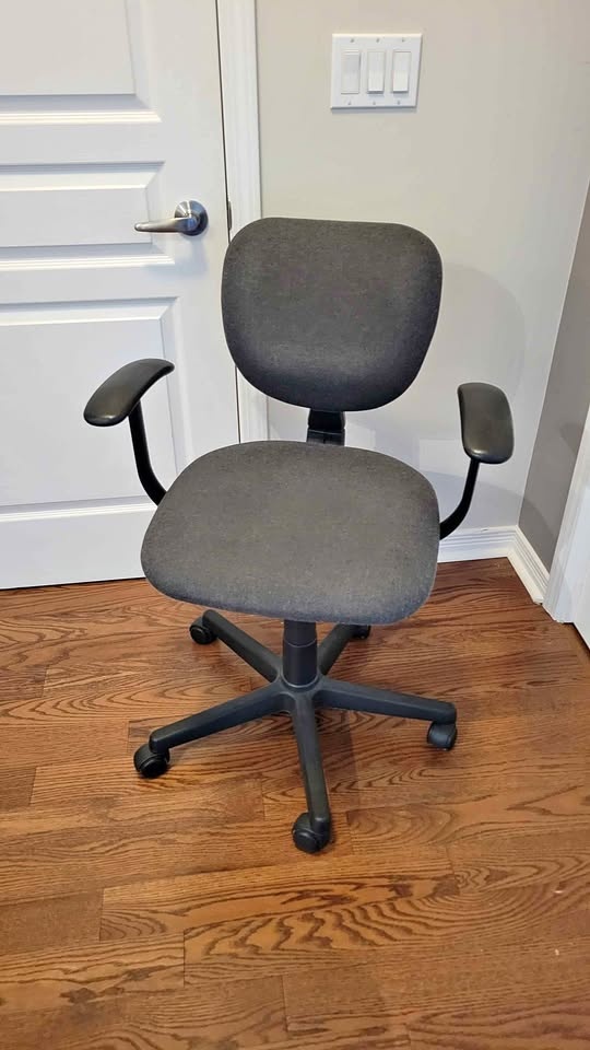 Office chair with armrests and rollers