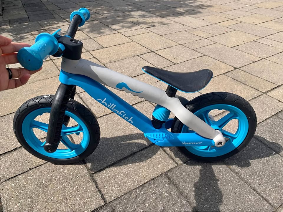 Toddler blue balance bike with adjustable seat height