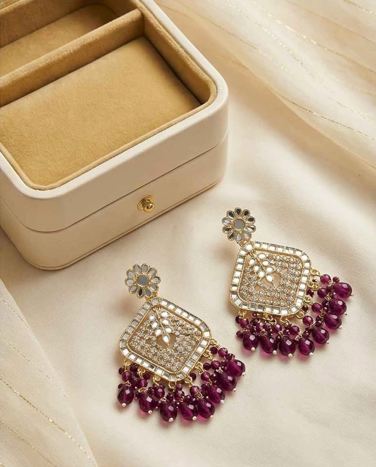 Gold tone mirror work earrings with purple beads