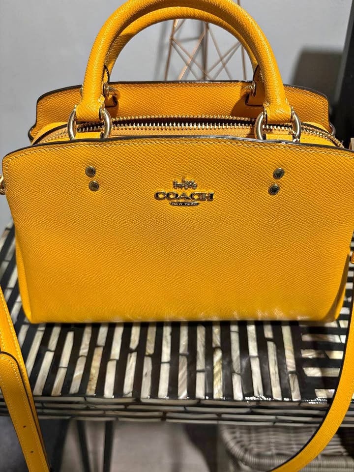 Yellow COACH purse. NEW