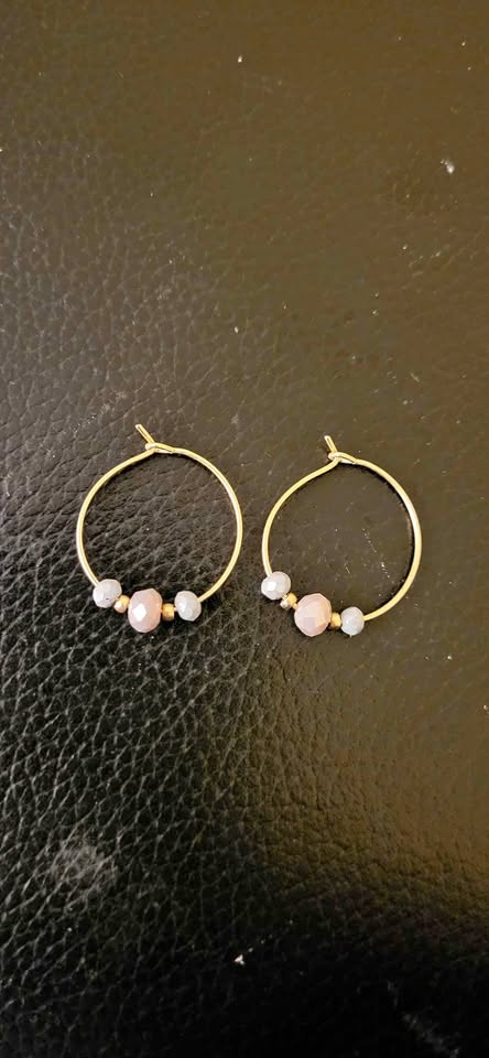 Gold hoop earrings with pinkish purple and grey beads