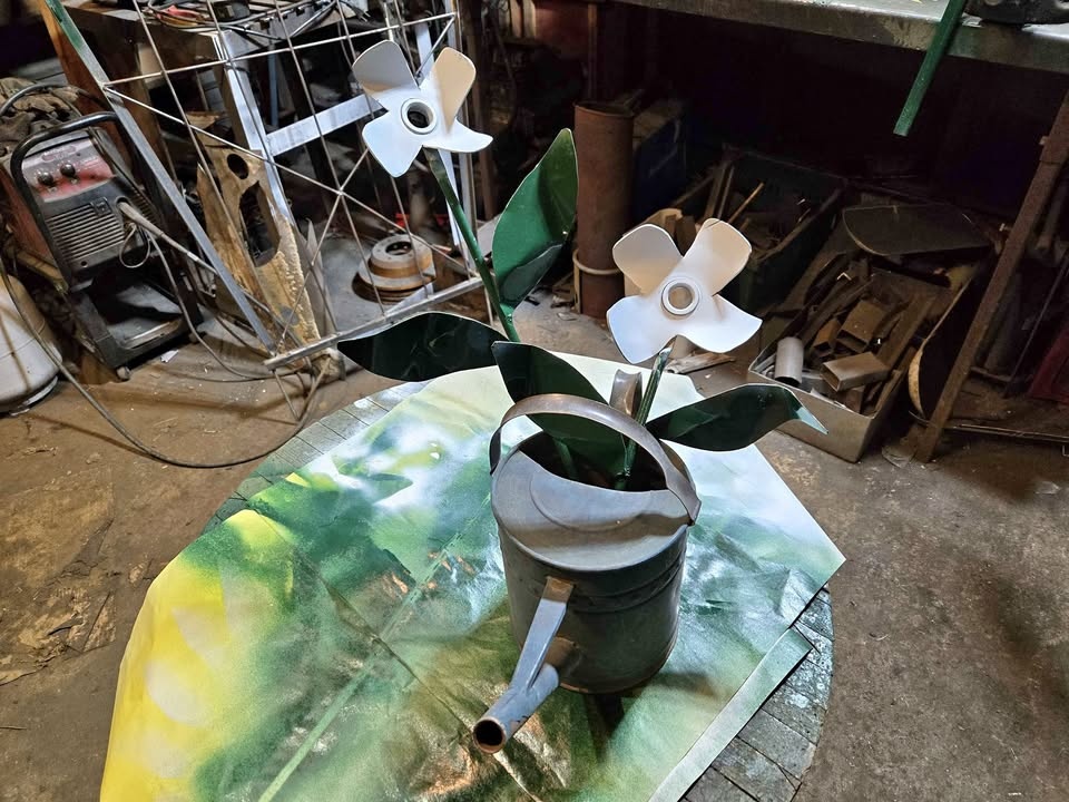 Metal Flowers in Vintage Watering Can