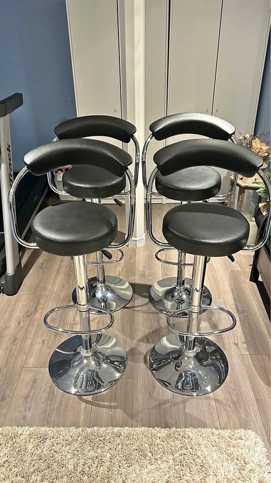 Four Black Adjustable Bar Stools
