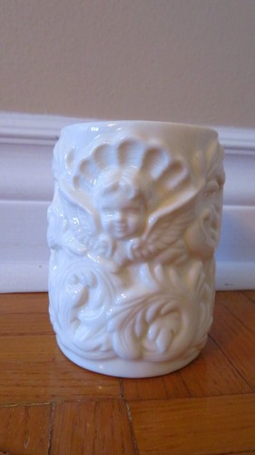 Vintage cute cup with angel face, wings white vase shell