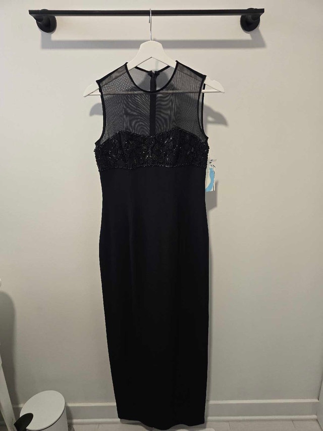 Brand new ladies size 4 elegant dress tags on